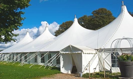 a line of sleek and modern portable toilets ready for use at an upscale corporate event in Westfield